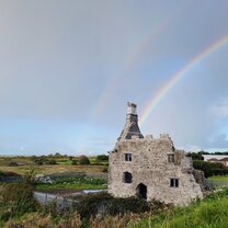 Double rainbow over castle ruins in Galway